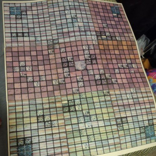 A barely-legible grid battle map in a rainbow of colors